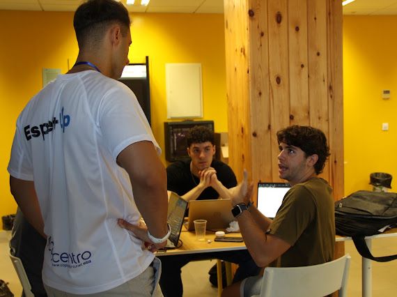 Discussing the project with a mentor during the Blockchain for Good hackathon