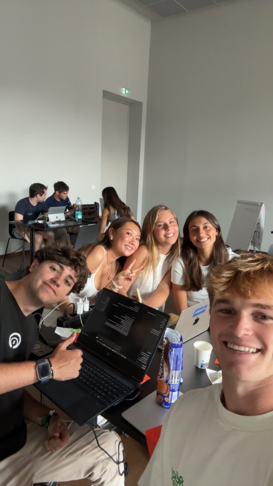 Selfie with the Rally team working on laptops