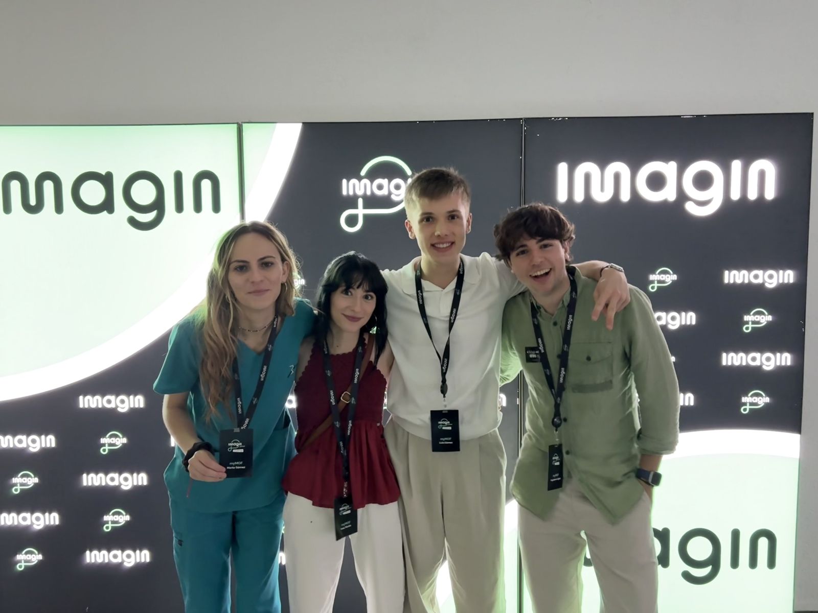 The myMOF team in front of the Imagin wall